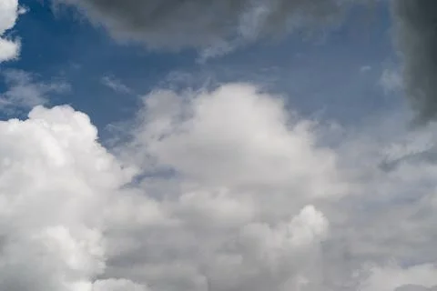 Wide textured cloudscape emphasizes layered forms, subtle shadows and highlig Stock Photos