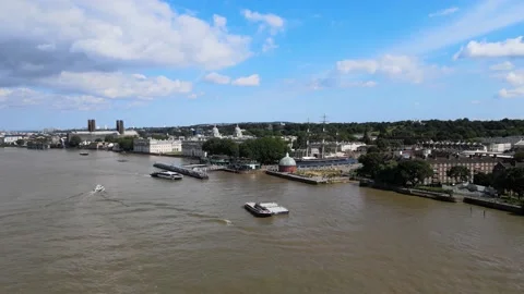 Wide Thames river bed, boat traffic at Greenwich Pier Stock Footage 160240247