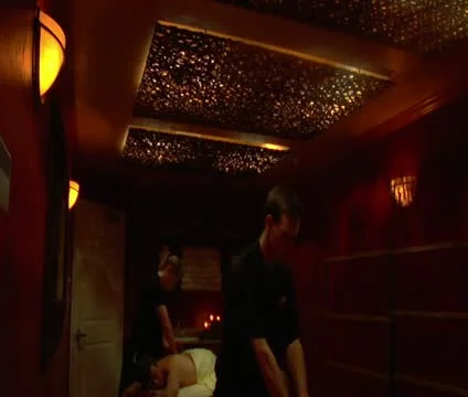 Wide tilt down of couples massage Stock Footage 21626076