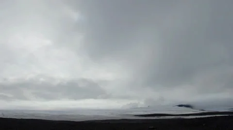 Wide time-lapse of clouds over a glacier in Iceland Stock Footage 30376935