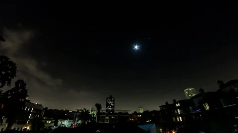 A Wide Time Lapse of a Lunar Eclipse in LA Stock Footage 74668862
