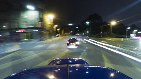 Wide Timelapse of car driving at night in Edinburgh  (24p) Stock Footage 137441353