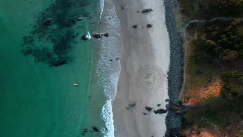 Wide top down drone shot with ocean wave... | Stock Video | Pond5