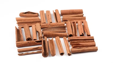 Wide Top View Rotating Cinnamon Sticks On White Background Vídeo Stock 331386221