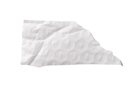 A wide torn piece of bubble wrap with visible circular texture, creases, and Stock Photos