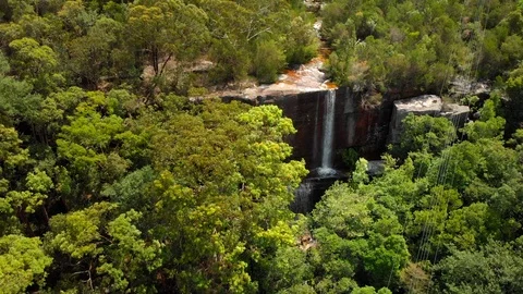 Wide tracking toward shot of waterfall in Australian bush Stock Footage 124509484