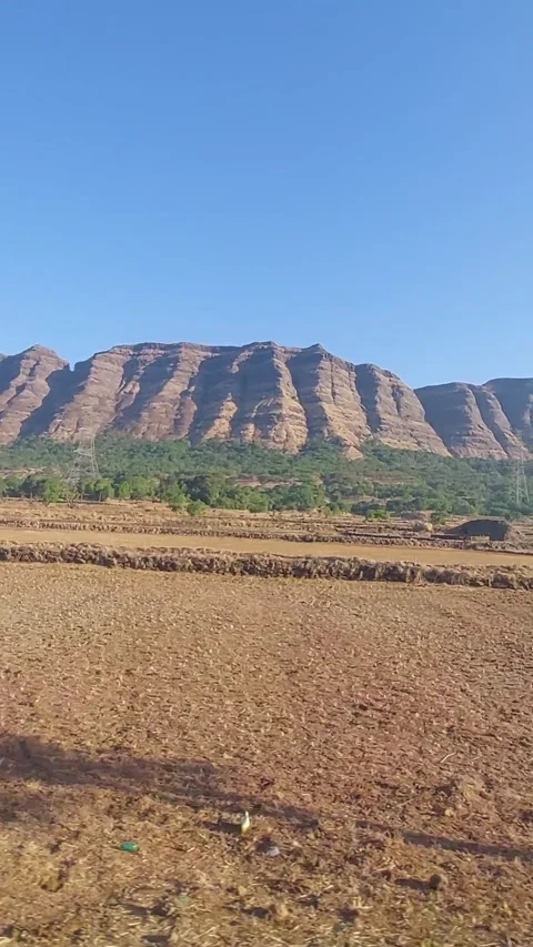 Wide vertical view of long mountain range landscape in morning sunlight Stock Footage 279318383