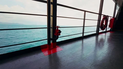Wide View Along Ferry Deck With Red Fire Valve and Lifebuoy Near Railing Facing Video stock 328392490