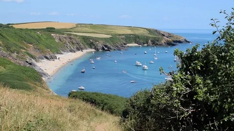 Wide view of beautiful beach in Cornwall with boats and golden sands Stock Footage