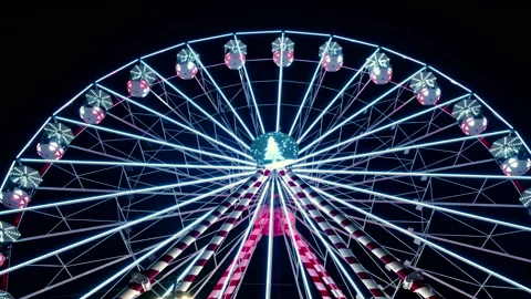 A wide view from below of a huge ferris wheel with colourful lights in amusement Stock-Footage 186183471