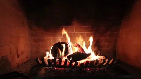 A wide view on a big fireplace with burning firewood. Stock Footage 267561901