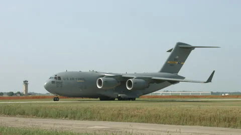 Wide view of C-17 Globemaster taxiing at airfield 4K Stock Footage 42753178