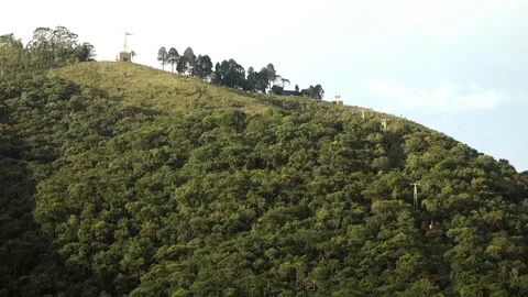 Wide view of cable car line cutting through mountain towards peak of Christ the Vídeos de archivo 328970866
