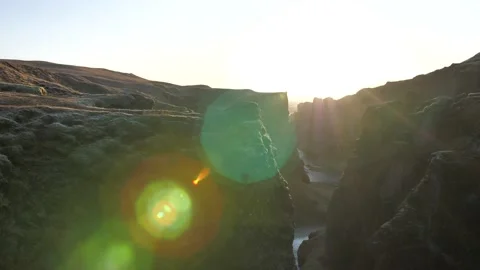 Wide view of a canyon in iceland with sun flare and sunset Stock Footage 158746853
