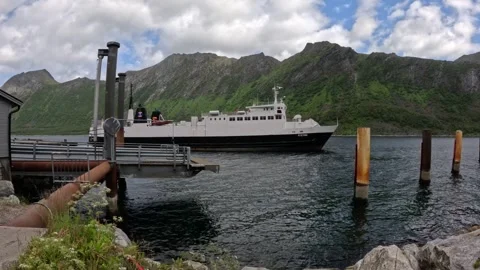 Wide view of car ferry MF Viren docking at terminal pier in Gryllefjord Norway 動画素材 342755735