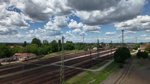 A wide view of a complex train yard in Hungary with many tracks under a Stock Footage 337944767