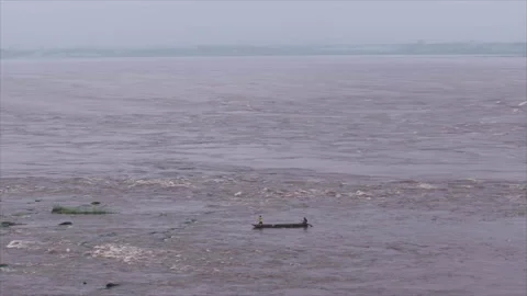 Wide view of Congo River with boat in foreground from drone, Brazzaville Stockbeeldmateriaal 331999325