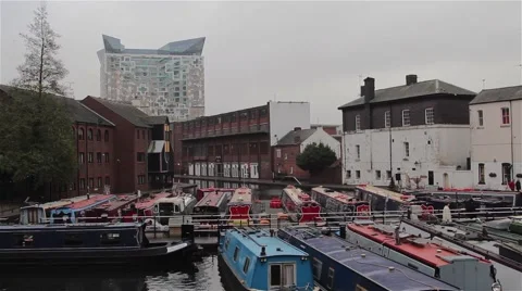 Wide View of The Cube Building and Narrow Boats Docked in Canal Harbor Stock-Footage 44524825