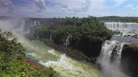 Wide view of Devil's Throat on Brazil side, pan right across the Iguazu River Stock Footage 333794665