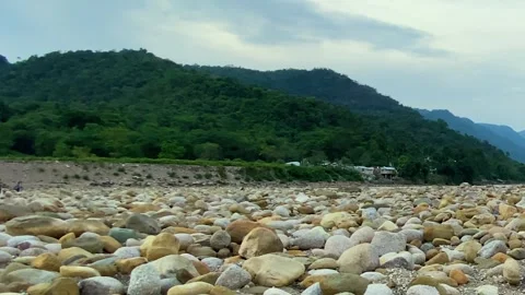Wide view of a dry stone riverbed in Bichanakandi, Bangladesh near the Khasi Stock Footage 326025800