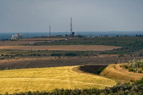 Wide view of fields and a communication tower in the countryside during the.. Stock Photos
