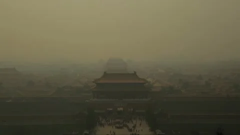 Wide View of Forbidden City in Beijing Shrouded by Heavy haze with Crowds Below Stock Footage 345821906