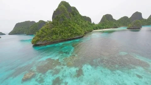 Wide view of FPV drone over the limestone rocks of  Raja Ampat, Indonesia. Stock Footage 293329039