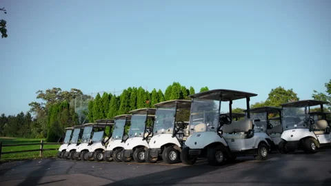 Wide view of Golf carts parked in the designated area at a golf club. Neatly 库存影片 297090180