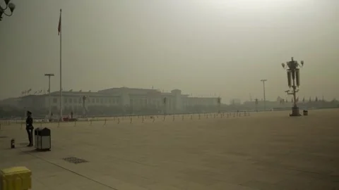 Wide View of Guard and Statue in Hazy Morning at Tiananmen Square Beijing China Stock Footage 341782578