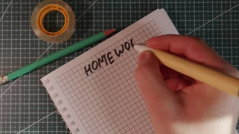 Wide view of hand writing Homework on grid paper Stock Footage 341269472