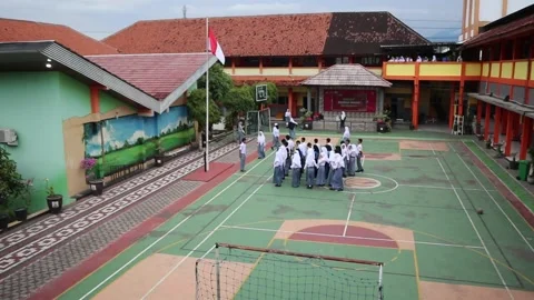 The wide view of the high school yard shows the main building and playground Stock Footage 218569956