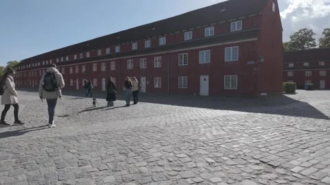 Wide view of the historic red barracks buildings and cobbled square, Kastellet Stock Footage 341289177