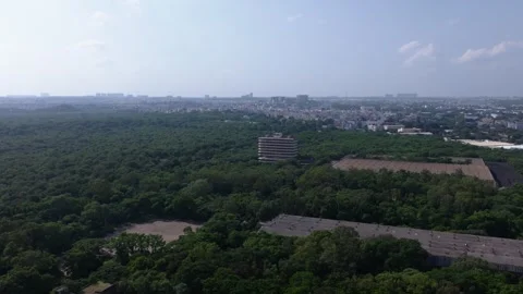 Wide view of HMT machine tools building with HMT township, greenery, sky and Stock Footage 346958941