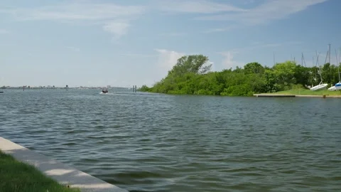 Wide View Horizontal looking across into Gulfport, Florida marina. Small boat he Stock Footage 285269343