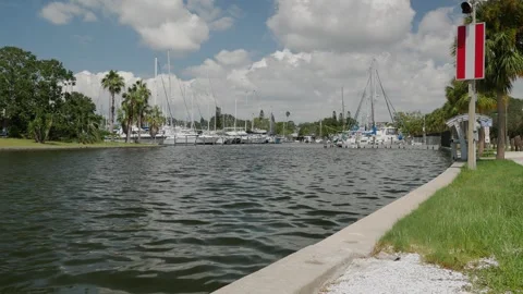Wide View Horizontal looking back into Gulfport, Florida marina. Blue sky and wh Stock Footage 285269385