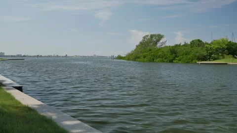 Wide View Horizontal looking out from Gulfport, Florida marina. Blue sky and whi Stock Footage 285269239