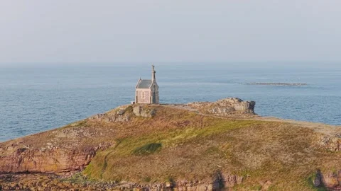 A wide view of the iconic chapel on Ilot Saint Michel, perched atop a rocky Stock Footage 346668080