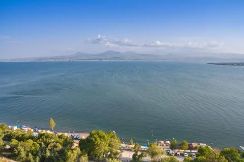 Wide view of Lake Sevan and surrounding mountains Stock Photos