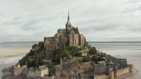Wide View of Le Mont Saint Michel Castle in the Ocean in France, Aerial, Cloudy Stock Footage