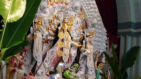 Wide view of Maa Durga idol with white and silver decorations and Lakshmi, .. Stock Footage 346729867