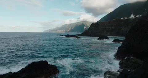 Wide view of Madeira’s dramatic coastline at Seixal, with turquoise waves, sea Stock Footage 312030838