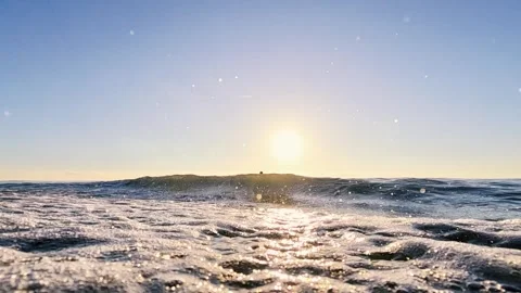 Wide view of a man jumping into the sea from a run-up at sunset Stock Footage 263621458