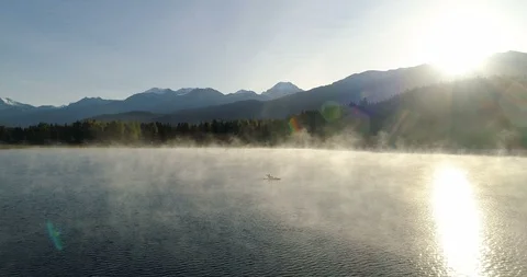 Wide View Of Man Kayaking, Lake, And Mountains At Sunrise 스톡 동영상 101041616