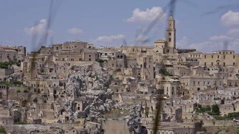 Wide view of Matera, defocused straws in the foreground. Version 1 Stock Footage 288597971