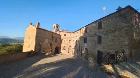 Wide view of a medieval stone square with historic buildings 動画素材 346767755