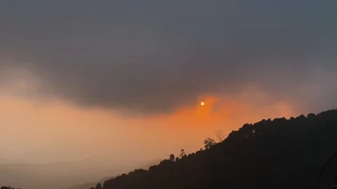 Wide View Of Moody Sunset Over Mountain Ridge In Bali 動画素材 342266191