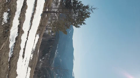 Wide view on mountains. Slide camera view from right to left side.Vertical video Video stock 127981854