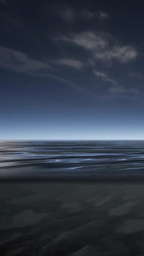 Wide view of ocean water at dusk with soft waves and cloudy sky Stock Footage 346755519