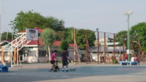 Wide view of an open public outdoor basketball and sports court Stockbeeldmateriaal 331706337