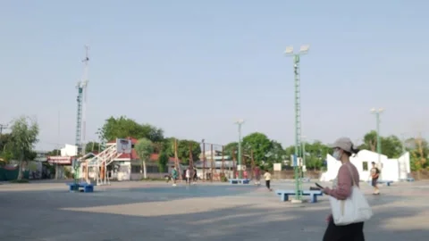 Wide view of an open public outdoor basketball and sports court Stock Footage 334413152